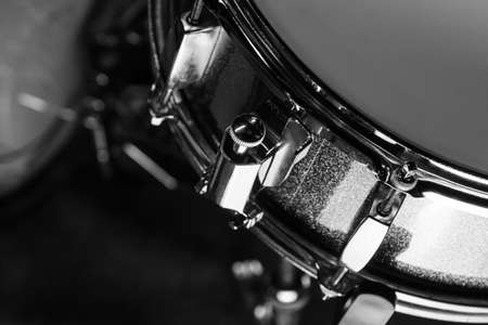Snare drum in black background, close-up, low lght, black and whiteの写真素材