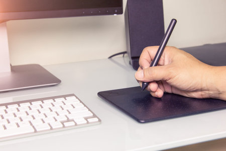 Close up hands male working on graphic tablet