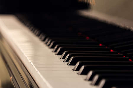 Piano background with selective focus. Warm color toned imageの写真素材