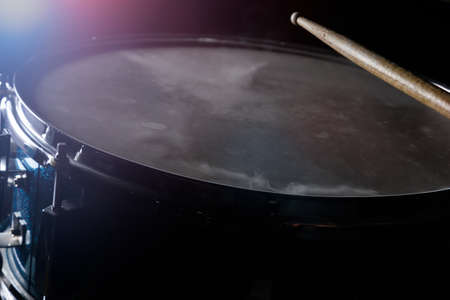 The drum sticks and snare drum in low light background.の写真素材