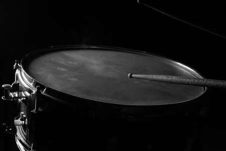 The drum sticks and snare drum in low light background.の写真素材