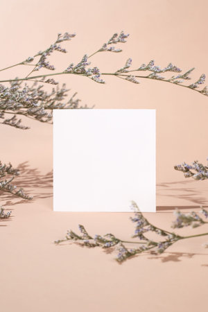 White invitation card with coconut leaf shadow