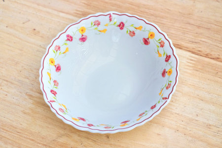 white dish flower on the table woodの写真素材