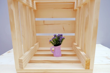 Wooden Box with Purple Little Flower in Potの写真素材