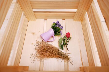 Close Up Wooden Box with Purple Little Flower in Potの写真素材