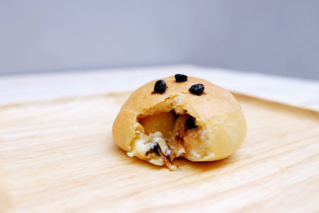 Close Up Bread filled with White Chocolate in dish Wood