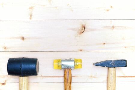 Hardware tools set of hammers on wooden backgroundの写真素材