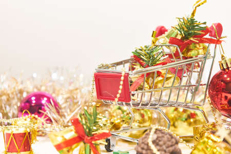 shopping cart and Christmas decorations with white background, Xmas themeの写真素材