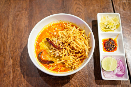 Khao Soi Recipe, Thailand Northern Style Curried Noodle Soup with Chicken meat and spicy coconut...