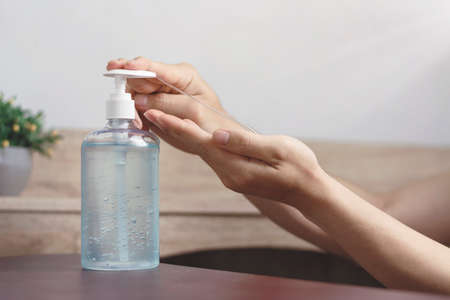 Alcohol gel or soap sanitizer anti virus bacteria on the wooden table, dirty skin care hygiene concept. prevent the spread of germs and avoid infections coronavirus at home.の写真素材