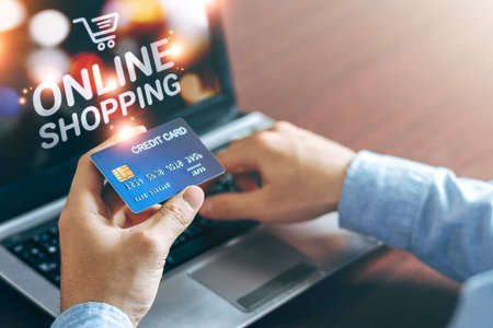 E-commerce and online shopping concept, Business men use laptops and hold credit cards for online...