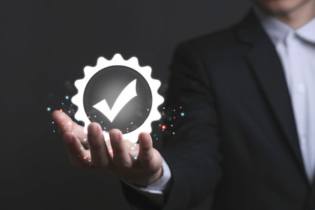Businessman hand shows the sign of the top service Quality assurance, Guarantee, warranty, Social Responsibility Standard Certified, ISO certification and standardization concept.の写真素材