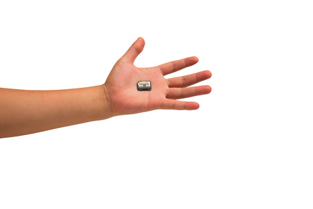 isolated hand holding micro sd cardの写真素材