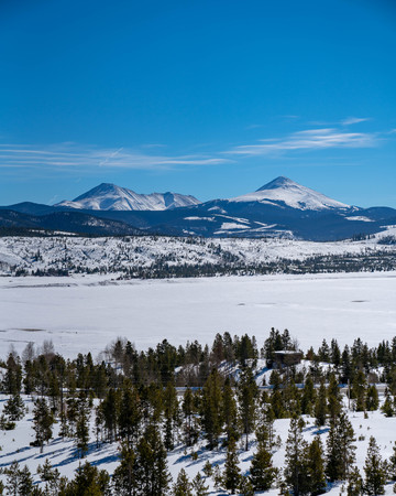 snowy landscape with mountains and snow plainsの写真素材