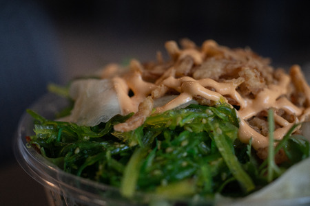 close up of poke bowl with seaweedの写真素材
