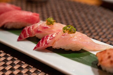 White fish sushi at upscale japanese restaurantの写真素材