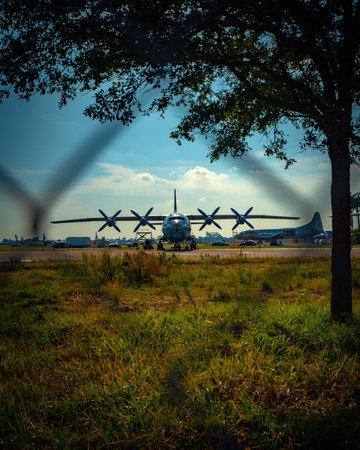 view of cool cargo plane through a fence for aviation purposesの写真素材