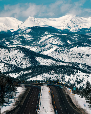 Huge highway leading into the mountain landscape during winter