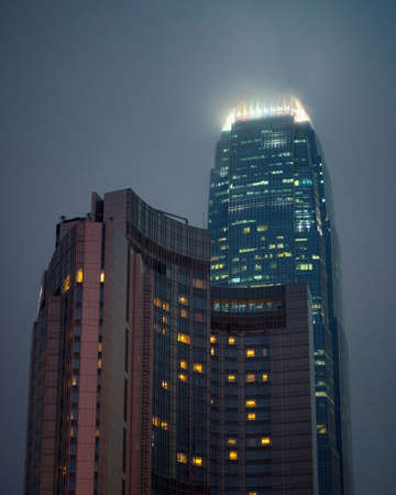 beautiful skyscraper at night with fog in backgroundの写真素材