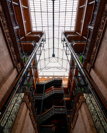 inside of a train station with amazing layers of architecture and sunlightの写真素材