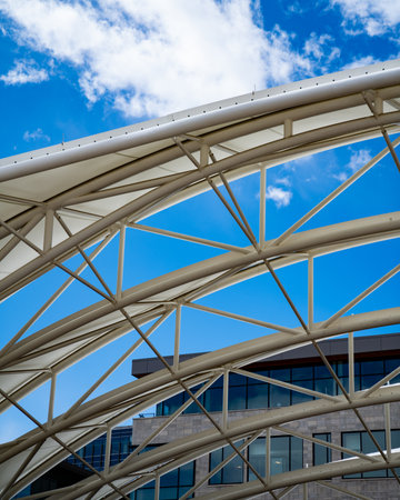 interesting bridge and tunnel architecture with blue cloudy backgroundの写真素材