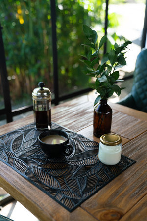 coffee with milk in french press at rustic restaurant in south americaの写真素材
