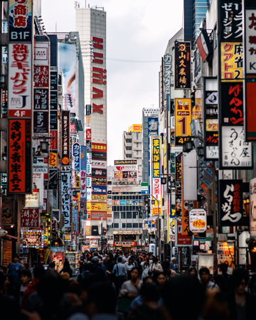 packed downtown city in tokyo japan filled with many signs and loudnessのeditorial素材