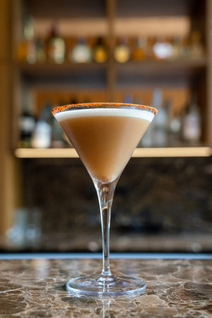 amazing martini cocktail with fancy rim at the bar of fine dining restaurant during the day