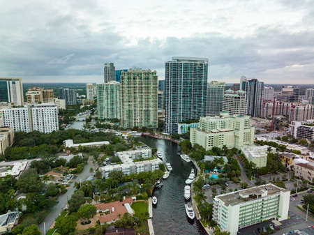 river cutting between downtown fort lauderdale during a cloudy day from a droneの写真素材