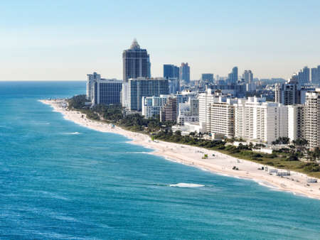 beach front shoreline of hotels and buildings in miami from a droneの写真素材