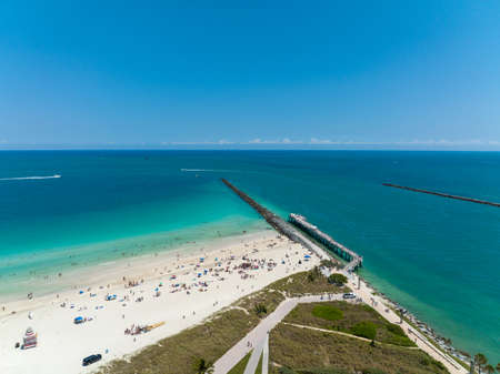 epic aerial drone shot of miami beach florida at south pointe park during the summerの写真素材