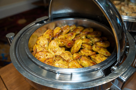 sweet chili chicken on large serving platter ready to be served at corporate event during a business eventの写真素材