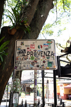 provenza welcome signed littered with stickers and vandalism on a bright summer dayの写真素材