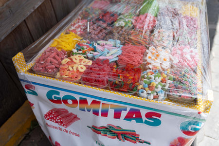 close up of candy food stall in outdoor market in central america with many gummies and taffiesの写真素材