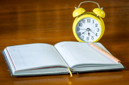 retro alarrm clock and notebook.の写真素材