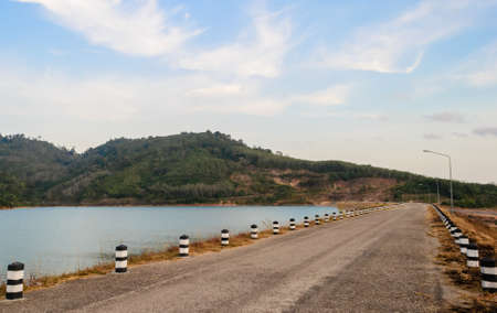 asphalt road and reservoir,Phuket in Thailandの写真素材