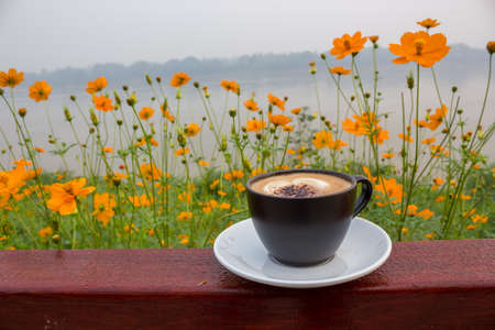 A cup of coffee at Mekong River before sunrise in Chiang Khan Thailandの写真素材