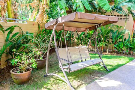 swing bench in tropical garden,Phuket in Thailandの写真素材