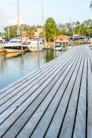 Row of yachts at the harbor and Many luxury yachts park at the harbor in Phuket boat lagoon,Thailandの写真素材