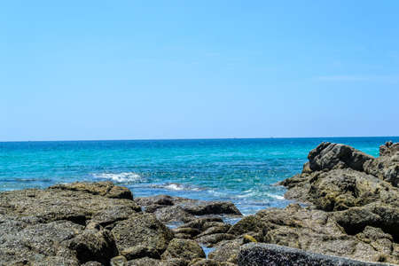 Rocks on the beach with blue sky background in Phuket,Thailandの写真素材