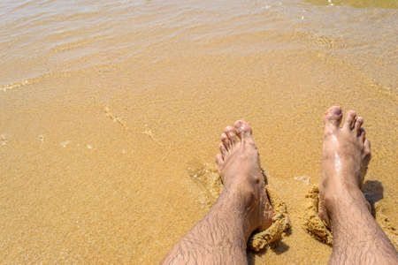 feet on the sand beachの写真素材