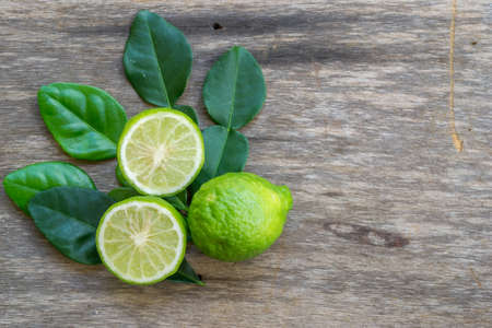 Bergamot with leafs on wood backgroundの写真素材