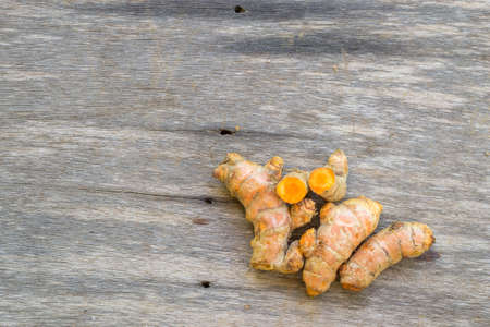 Group of turmeric on old wooden backgroundの写真素材