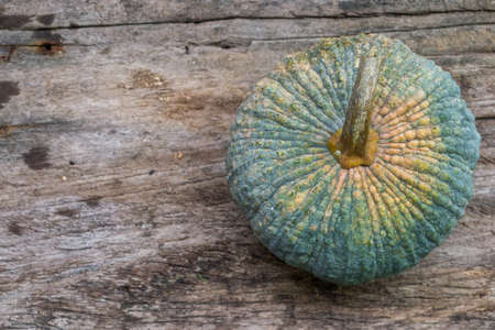 Thai pumpkin on old wooden background.の写真素材