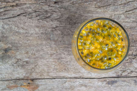 passion fruit juice isolated on wood background.の写真素材