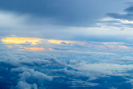 Sunset with clouds view from the window of an airplaneの写真素材