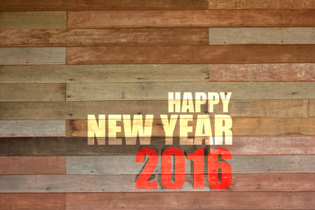 Happy New Year 2016 word on vintage wood wall background