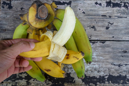 Bananas on a vintage wooden tableの写真素材