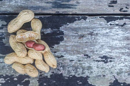peanuts on the vintage wooden backgroundの写真素材