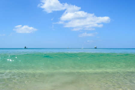 Clear sea water with blue sky , Layan beach Phuket in Thailandの写真素材